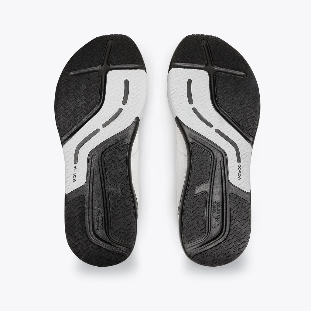 Women's Mount to Coast. R1. White upper. Black midsole. Bottom view.