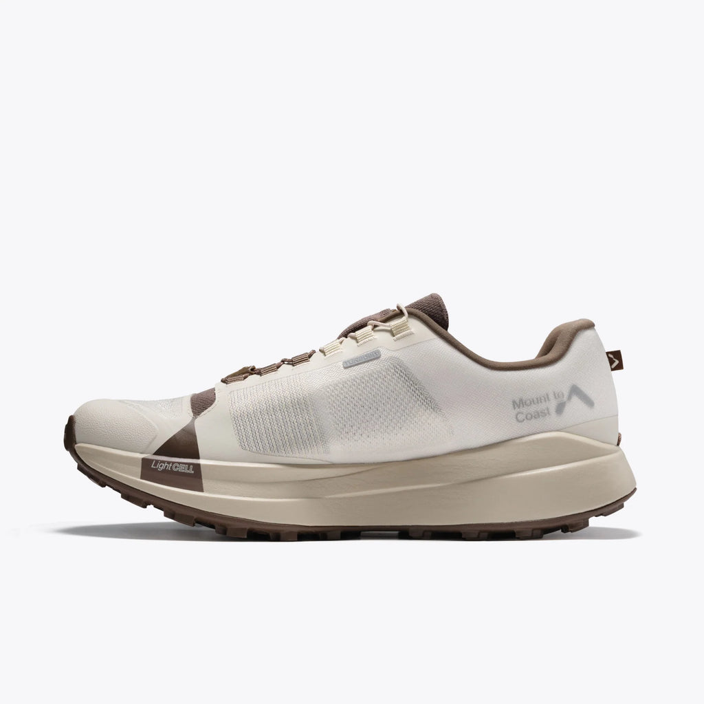 Women's Mount to Coast T1. Light Grey upper. Tan midsole. Medial view.