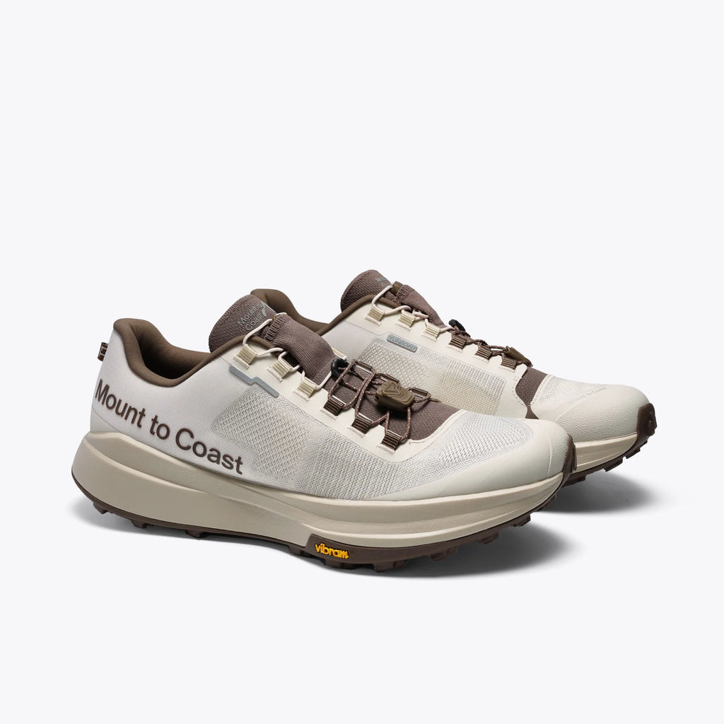 Women's Mount to Coast T1. Light Grey upper. Tan midsole. Lateral view.