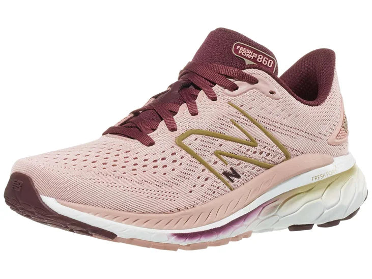 Women's New Balance 860v13. Pink upper. White midsole. Lateral view.