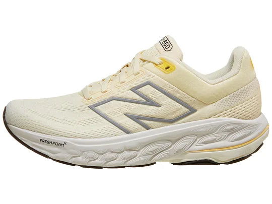 Women's New Balance 860v14. Light Yellow upper. White midsole. Lateral view.