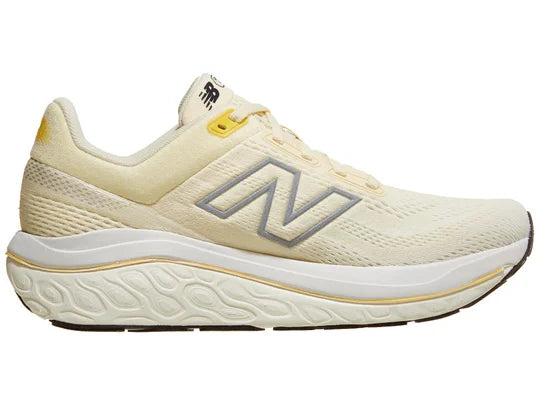 Women's New Balance 860v14. Light Yellow upper. White midsole. Medial view.
