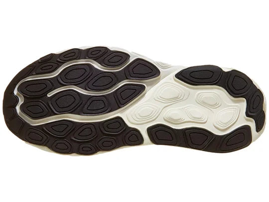 Women's New Balance 860v14. Light Yellow upper. White midsole. Bottom view.