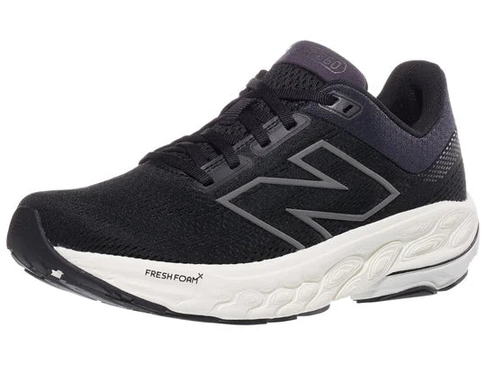Women's New Balance 860 v14. Black upper. White midsole. Lateral view.