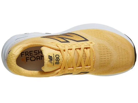 Women's New Balance 880v15. Yellow upper. White midsole. Top view.