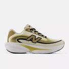 Women's New Balance Ellipse. Black, gold, and white upper. White and gold midsole. Lateral view.
