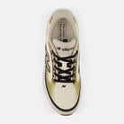 Women's New Balance Ellipse. Black, gold, and white upper. White and gold midsole. Top view.