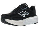 Women's New Balance More v6. Black upper. White midsole. Lateral view.