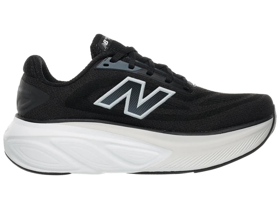 Women's New Balance More v6. Black upper. White midsole. Medial view.