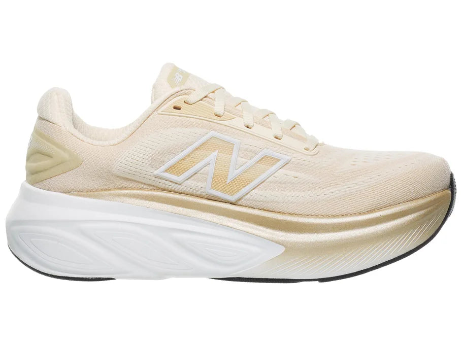Women's New Balance More v6. Off White upper. White midsole. Medial view.