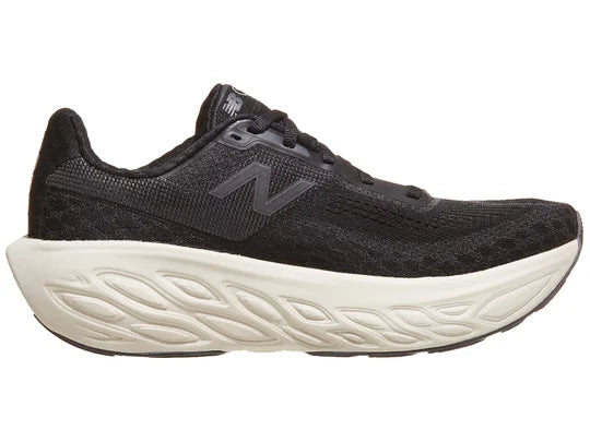 Women's New Balance 1080 v14. Black upper. White midsole. Medial view.