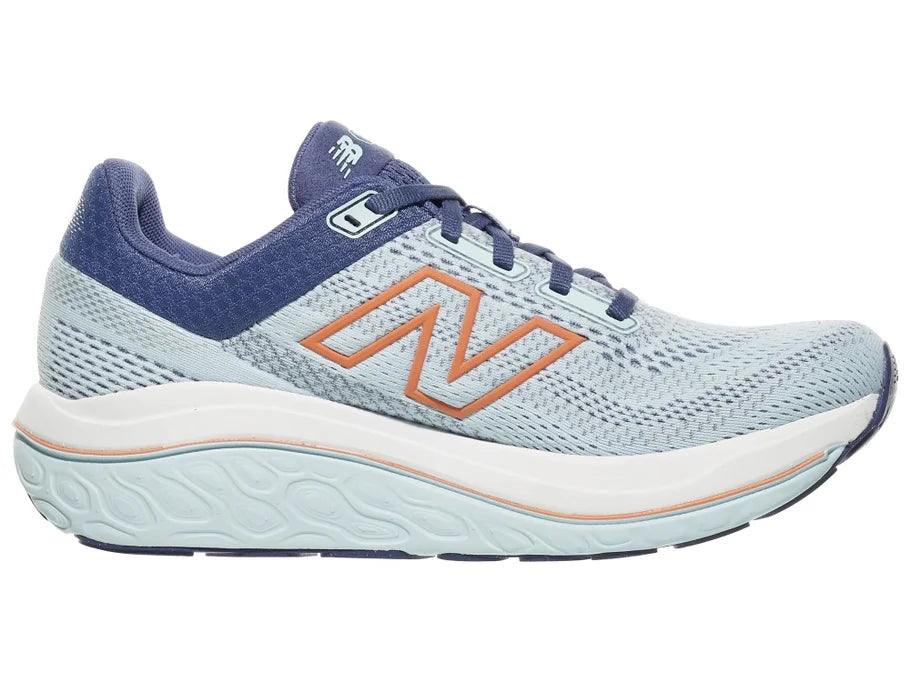 Women's New Balance 860 v14. Light Blue upper. White midsole. Medial view.