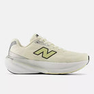 Women's New Balance Fresh Foam X 860 v15. Beige upper. White midsole. Lateral view.
