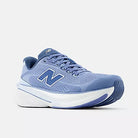 Women's New Balance 860 v15. Blue upper. White midsole. Lateral view.