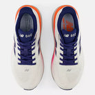 Women's New Balance 860 v15. White upper. White/Pink/Orange midsole. Top view.