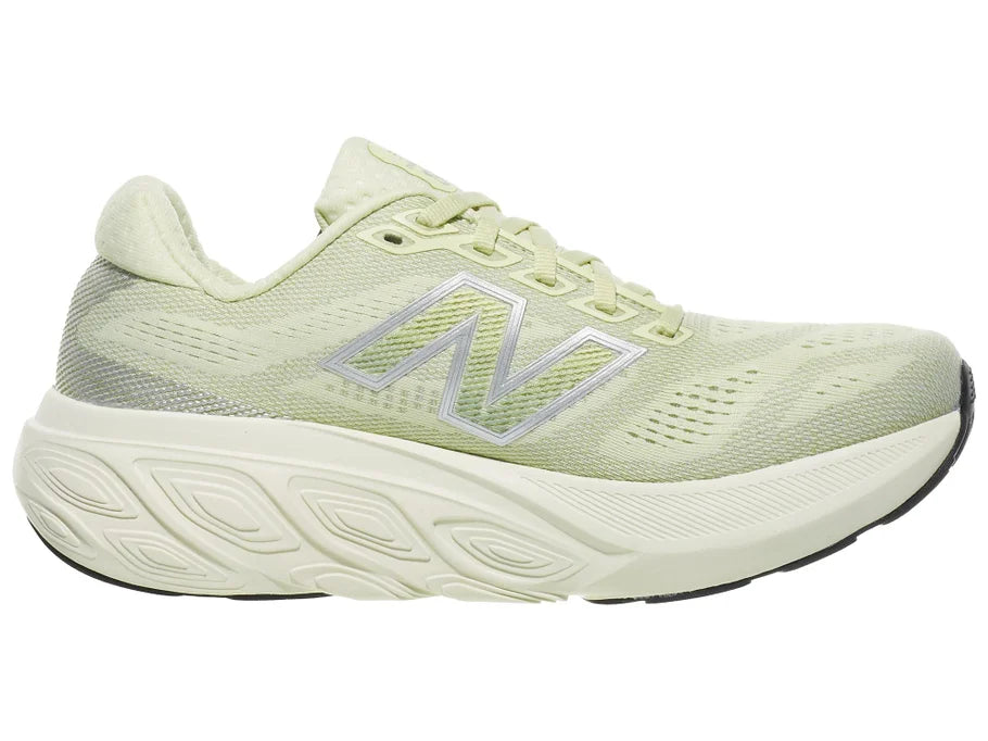 Women's New Balance 880 v15. Light Green upper. Off White midsole. Medial view.