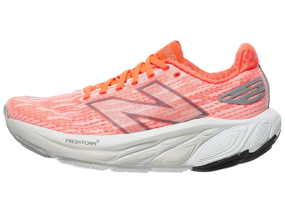 Women's New Balance Balos v1. Light Red upper. White midsole. Lateral view.