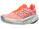 Women's New Balance Balos v1. Light Red upper. White midsole. Lateral view.