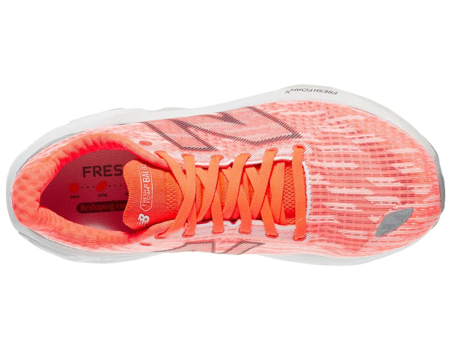 Women's New Balance Balos v1. Light Red upper. White midsole. Top view.