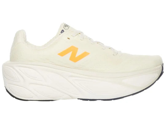 Women's New Balance More v5. Off White upper. White midsole. Medial view.