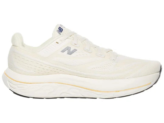Women's New Balance Vongo v6. White upper. White midsole. Medial view.
