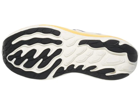 Women's New Balance Vongo v6. White upper. White midsole. Bottom view.