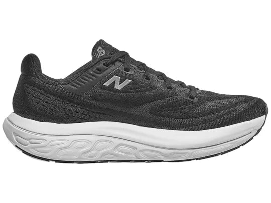 Women's New Balance Vongo v6. Black upper. White midsole. Medial view.