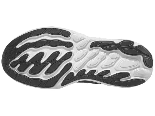 Women's New Balance Vongo v6. Black upper. White midsole. Bottom view.