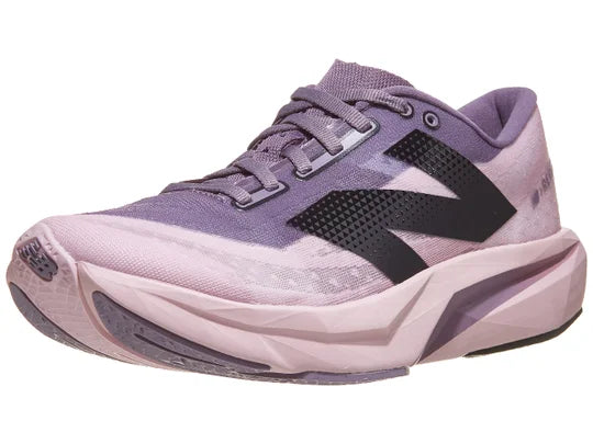 Women's New Balance FuelCell Rebel v4. Purple upper. Purple midsole. Lateral view.