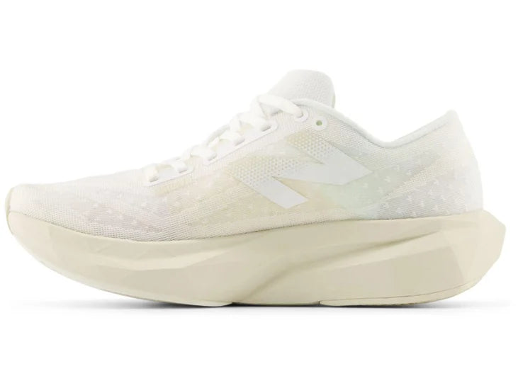 Women's New Balance FuelCell Rebel v4. Off White upper. Off White midsole. Medial view.