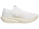 Women's New Balance FuelCell Rebel v4 in White/Linen/Sea Salt — medial view
