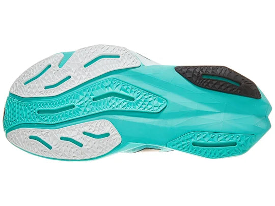 Women's New Balance Rebel v4. Green upper. Green midsole. Bottom view.