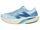 Women's New Balance Rebel v4. Blue upper. Off white midsole. Lateral view.