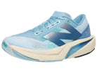 Women's New Balance Rebel v4. Blue upper. Off white midsole. Lateral view.