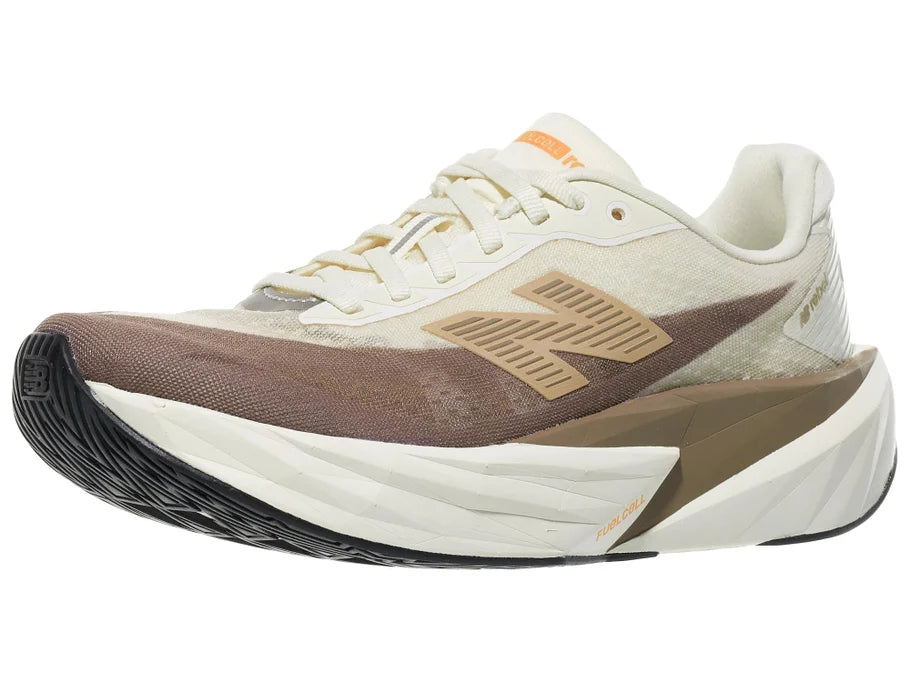 Women's New Balance Rebel v5. Off White/Tan upper. Off White/Tan midsole. Lateral view.