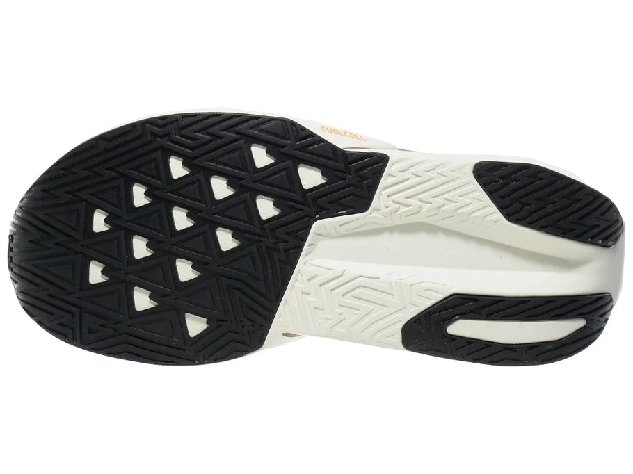 Women's New Balance Rebel v5. Off White/Tan upper. Off White/Tan midsole. Bottom view.