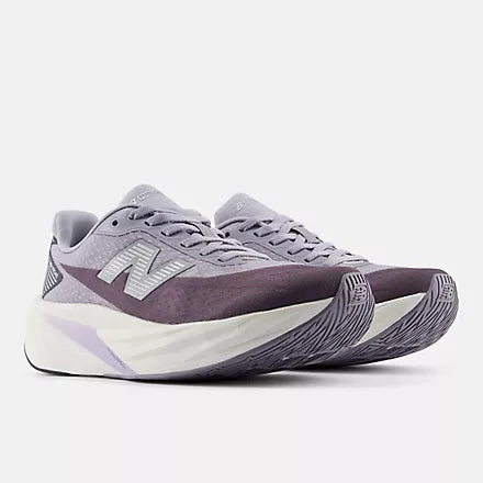 Women's New Balance FuelCell Rebel v5. Grey upper. White midsole. Lateral view.