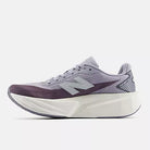 Women's New Balance FuelCell Rebel v5. Grey upper. White midsole. Medial view.