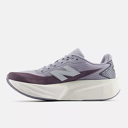 Women's New Balance FuelCell Rebel v5. Grey upper. White midsole. Medial view.