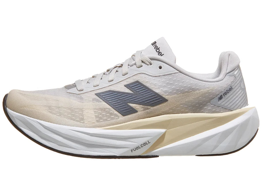 Women's New Balance Rebel v5. Grey upper. White midsole. Lateral view.
