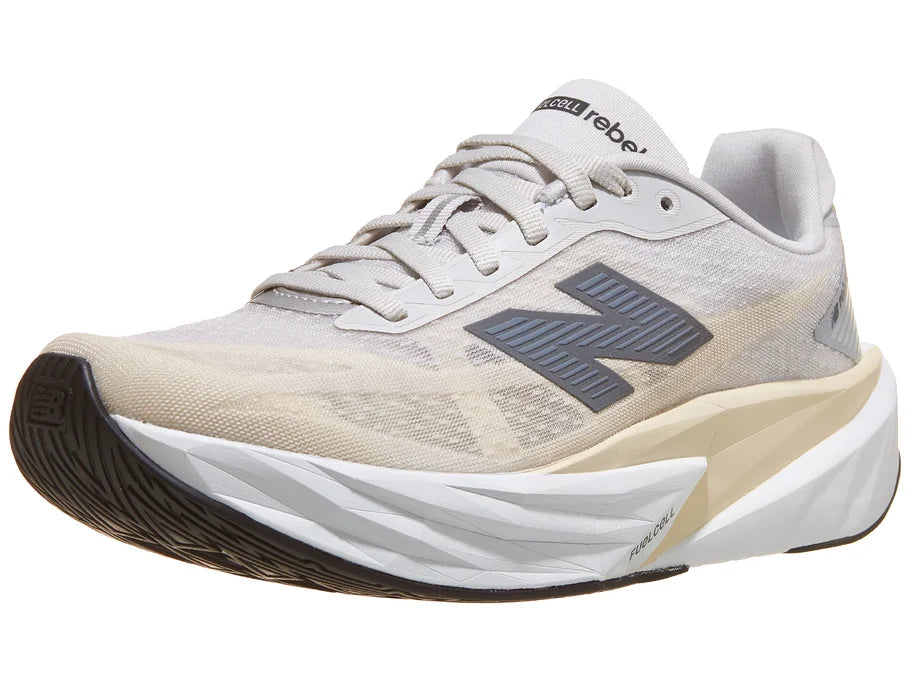 Women's New Balance Rebel v5. Grey upper. White midsole. Lateral view.