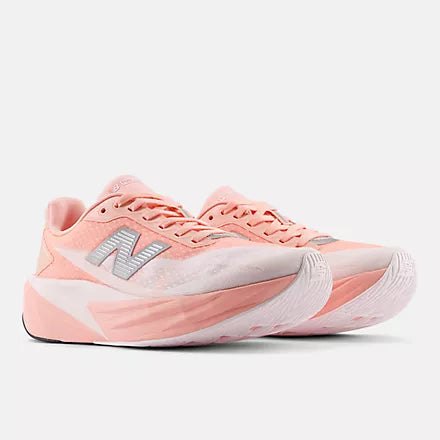 Women's New Balance FuelCell Rebel v5. White/Pink upper. White/Pink midsole. Lateral view.