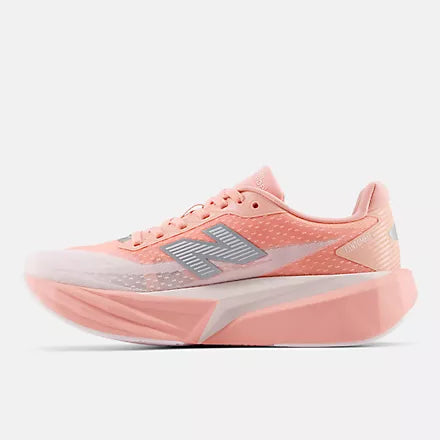 Women's New Balance FuelCell Rebel v5. White/Pink upper. White/Pink midsole. Medial view.