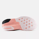Women's New Balance FuelCell Rebel v5. White/Pink upper. White/Pink midsole. Bottom view.