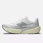 Women's New Balance FuelCell Rebel v5. Grey upper. Off White midsole. Medial view.
