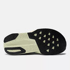 Women's New Balance FuelCell Rebel v5. Grey upper. Off White midsole. Bottom view.