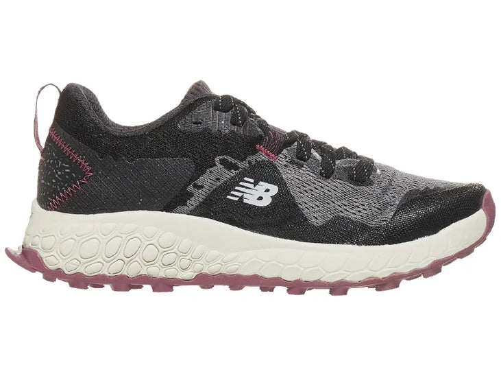 Women's New Balance Hierro v7. Black/Grey upper. Off White midsole. Medial view.