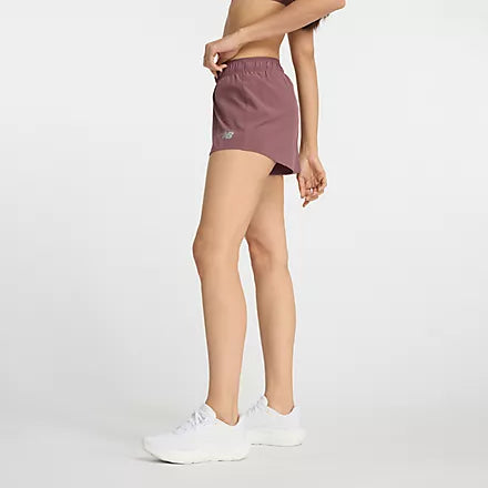 Women's New Balance RC Shorts. Dark Pink. Lateral view.