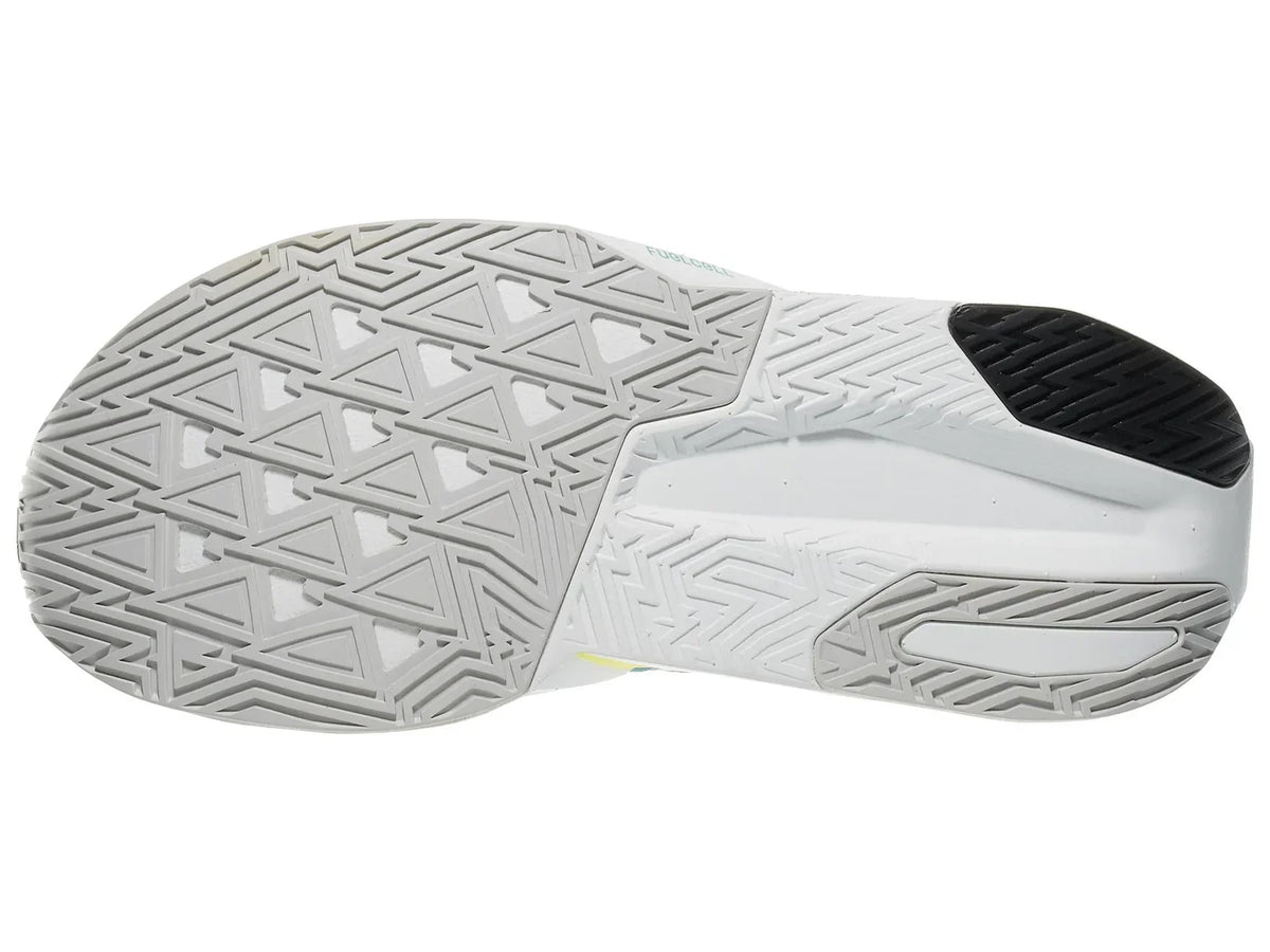 Women's New Balance Rebel v5. Neon yellow upper. White and neon yellow midsole. Bottom view.