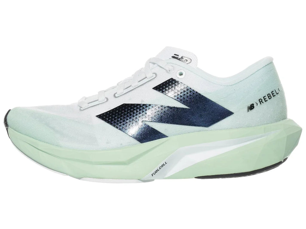 Women's New Balance Rebel v4. Light Green upper. Light Green midsole. Lateral view.